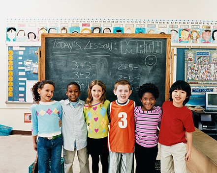 school group in front of blackboard