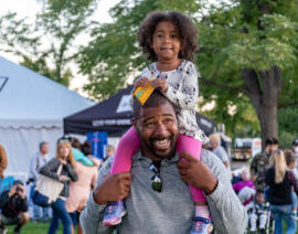 Man with child on shoulders